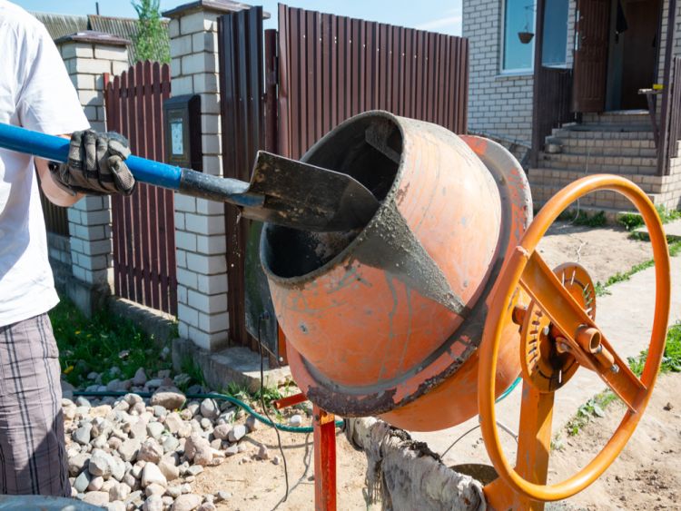 Worker Mixing Concrete Cement Using Concrete Cement Mixer Tool 1