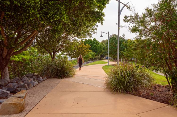 Woman Walking On Concrete Surface Road