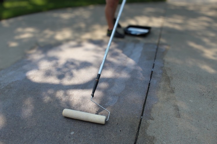 Worker Applying Concrete Hardener